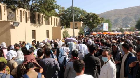 Afghans try to reach the airport in Kabul