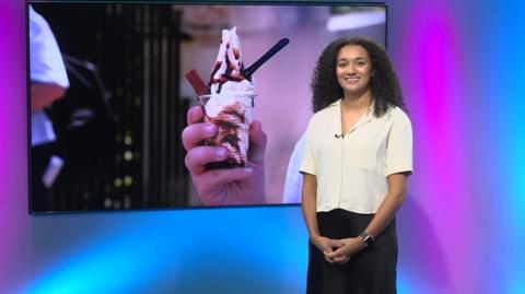 Nina in the studio with a picture of an ice cream