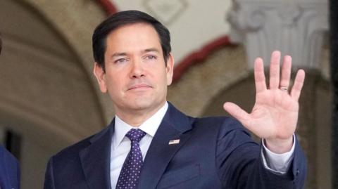 US Secretary of State Marco Rubio waves after arriving at the presidential palace in Panama City