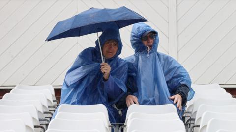 Fans in the rain