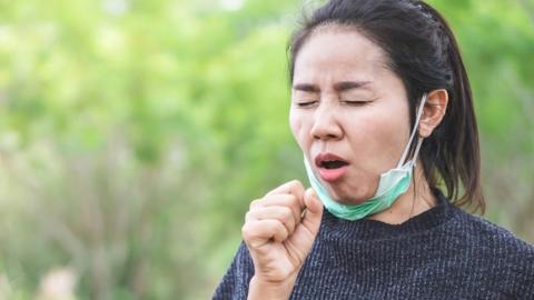 Woman coughing