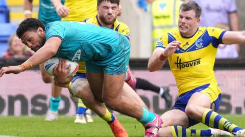Taane Milne scores a try for Huddersfield Giants