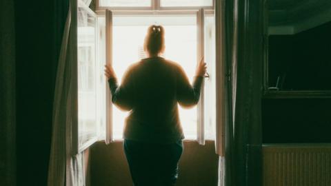 Generic picture of woman standing at a window
