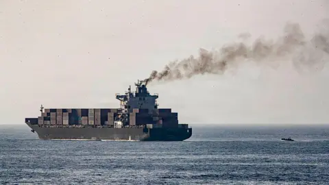 In this handout photo provided by U.S. Central Command, U.S. forces patrol the Arabian Sea near M/V Touska on April 20, 2026, after firing upon the Iranian-flagged vessel that the U.S. accused of attempting to violate the U.S. naval blockade of Iranian ports near the Strait of Hormuz. 
