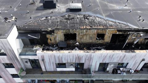 An aerial shot showing the roof and balcony where there was damage