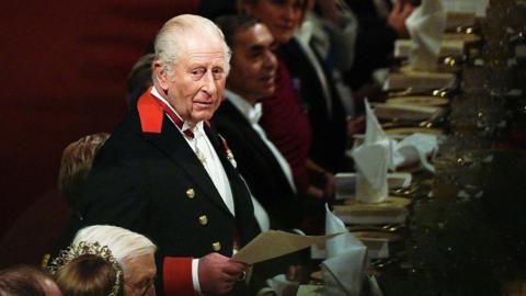Britain's King Charles III delivers a speech during a State Banquet at Windsor Castle in Windsor, on December 3, 2025, the first day of a three day state visit by the German President. President Frank-Walter Steinmeier received a ceremonial welcome to Britain