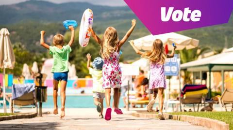 A group of children head towards a swimming pool on holiday.