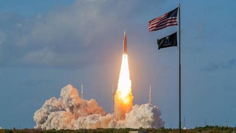 NASA's Artemis II Space Launch System rocket carrying the Orion spacecraft lifts off.