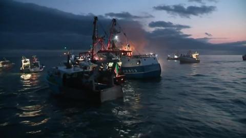 Boats in sea off Normandy coast