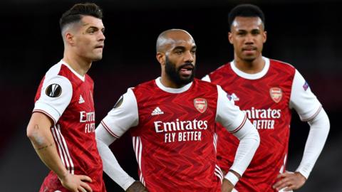 Arsenal's Granit Xhaka, Alexandre Lacazette and Gabriel Magalhaes reacts during their side's Europa League game with Slavia Prague