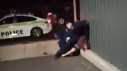Police officers attempt to arrested a man in South Australia