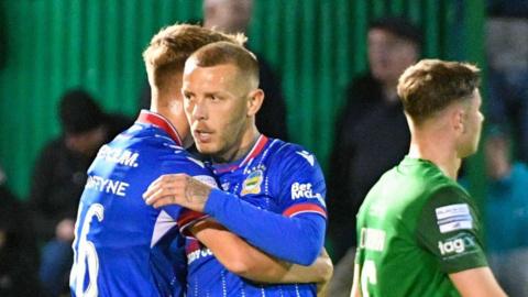 Kirk Millar celebrates scoring for Linfield