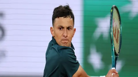 Emilio Nava focuses on shot