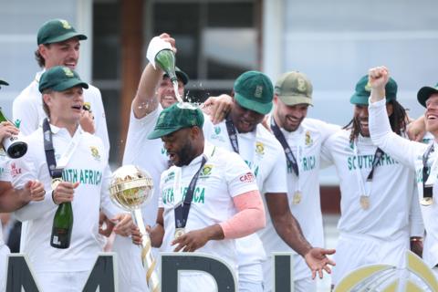 South Africa captain Temba Bavuma is doused in champagne by his team-mates after lifting the World Test Championship mace