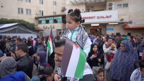 People in Gaza celebrate as a long-awaited temporarily ceasefire begins on Sunday