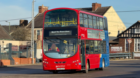 A Go North East bus. It is a red and blue double decker