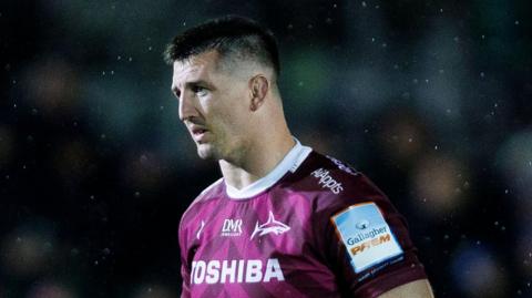 Ben Curry standing on the field during Sale's match against Bath