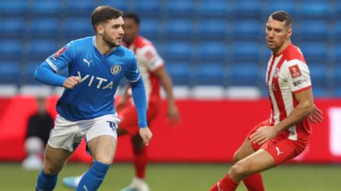 Stockport's Ethan Pye in action against Brackley