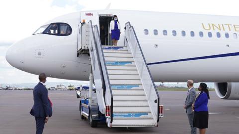 Priti Patel is met by delegates as she arrives in Rwanda