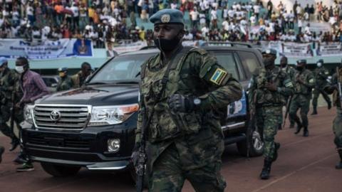 The motorcade of the President of the Central African Republic, arrives at the 20,000-seat stadium, for an electoral rally, escorted by the presidential guard, Russian mercenaries, and Rwandan UN peacekeepers