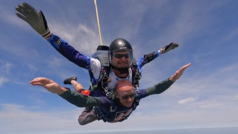 Mark Pile and a instructor taking part in the sky dive