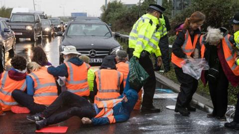 Police at M25 protest