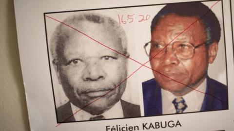 The date of arrest and a red cross are seen written on the face of Felicien Kabuga, one of the last key suspects in the 1994 Rwandan genocide