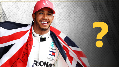 Lewis Hamilton celebrating holding a flag of Great Britain