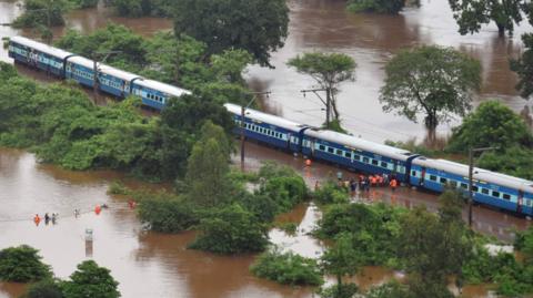 Aerial view of a stranded Indian train in a flooded area between Badlapur and Vangani following monsoon rains, 27 July