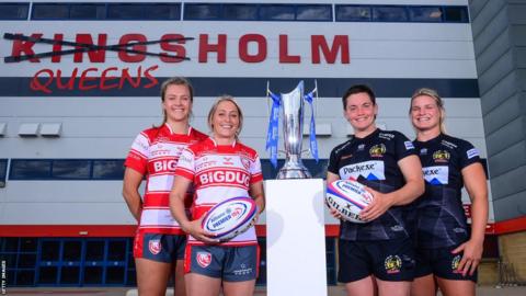 Gloucester and Exeter players pose with the Premier 15s trophy outside 'Queensholm' Stadium