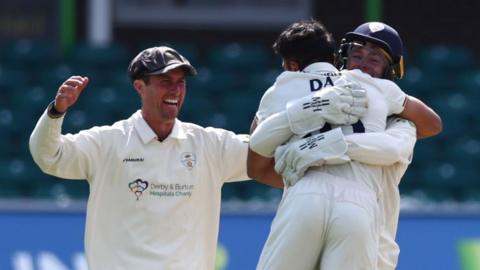 Derbyshire celebrate a wicket