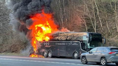 The rear of the coach on fire