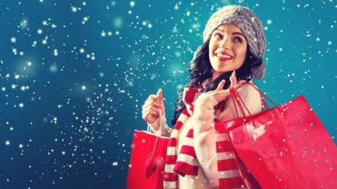 Young woman holding shopping bags