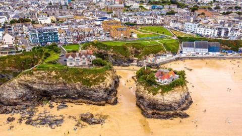Aerial view of houses next to Newquay beach