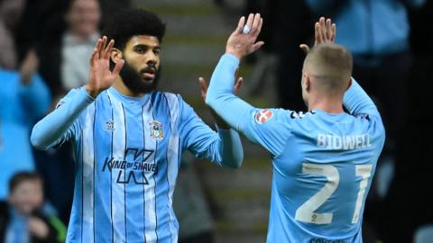 Ellis Simms celebrates his second goal against Maidstone with Jake Bidwell