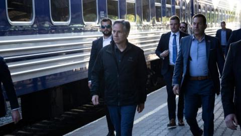 US Secretary of State Antony Blinken (3rd L) walks to board a Ukrainian Railways train at Przemysl Glowny train station while traveling to Kyiv, May 13, 2024