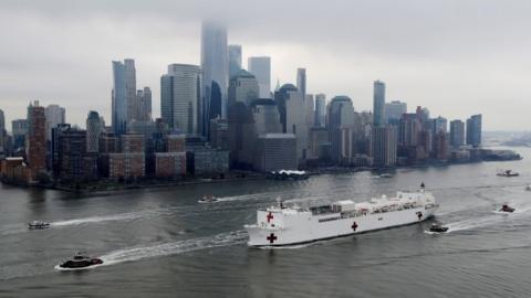 The USNS Comfort passes Manhattan as it enters New York Harbour