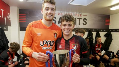 Mark Travers and Gavin Kilkenny celebrate winning the Hampshire Senior Cup for Bournemouth