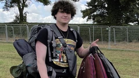 David Celino with bags at Leeds Festival