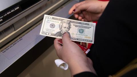 dollar at an ATM