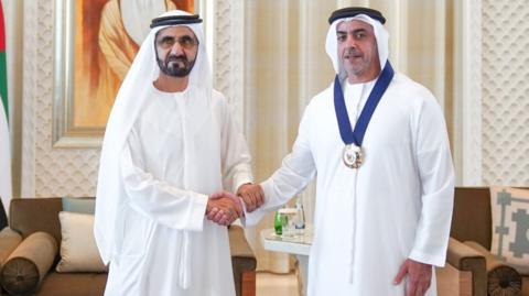 UAE Vice-President Sheikh Mohammed bin Rashid Al Maktoum (L) shakes hands with Sheikh Saif bin Zayed Al Nahyan (R), winner of Best Personality Supporting Gender Balance (27 January 2019)