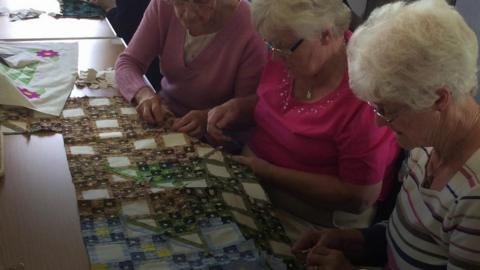 Women from St Cedma’s Parish Church making a quilt