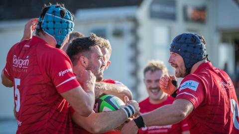 Jersey Reds players during match with Leicester Tigers