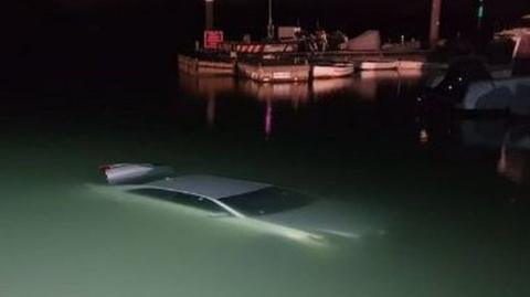 The car in the water after the accident in the New Forest