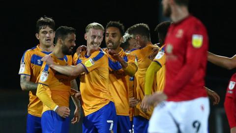 Mansfield celebrate a goal against Morecambe