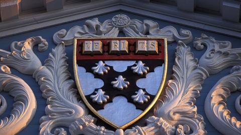 The Harvard seal detail on a pediment