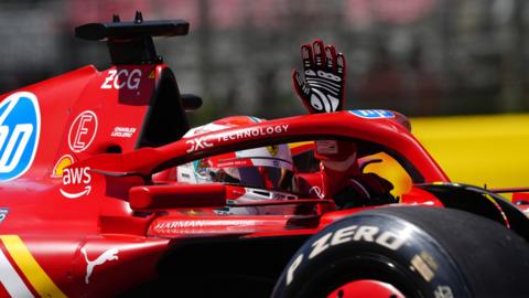 Ferrari's Charles Leclerc waves to the tifosi following first practice at Imola