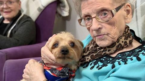 Care home resident and dog