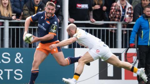 Edinburgh's Adam McBurney is tackled by Wasps' Dan Robson during an EPCR Challenge Cup Quarter-Final between Edinburgh Rugby and Wasps