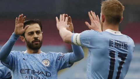 Bernardo Silva celebrates with Kevin de Bruyne